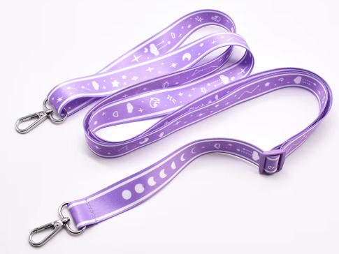Metal oval hook closure fastened on a fabric satin wrist strap