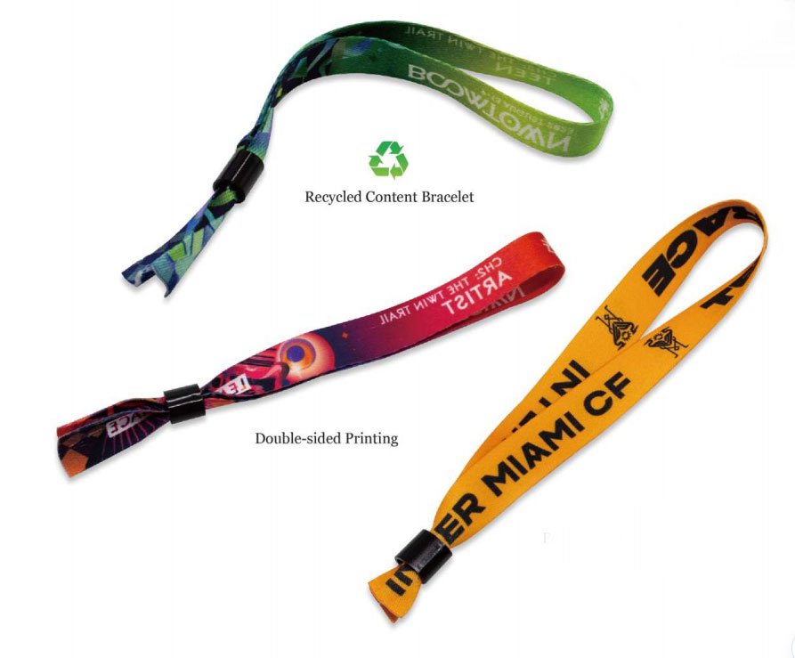Assorted custom satin wristbands laid out for VIP, crew, and guest access levels